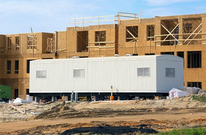 construction workers discussing plans in a rental office in Palm Harbor